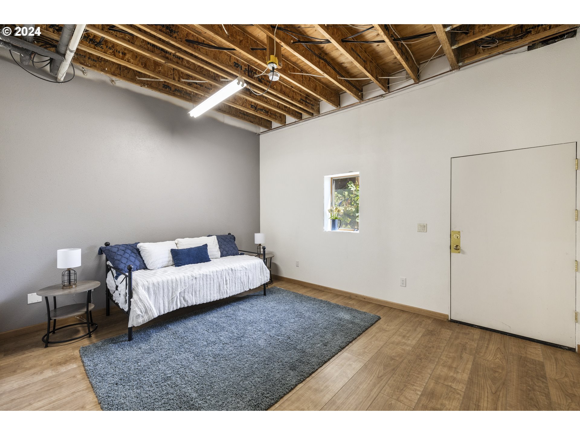 11400 Northwest Plainview Road Portland, OR 97231 - Photo 31 of 48 a bed room with a bed and a couch