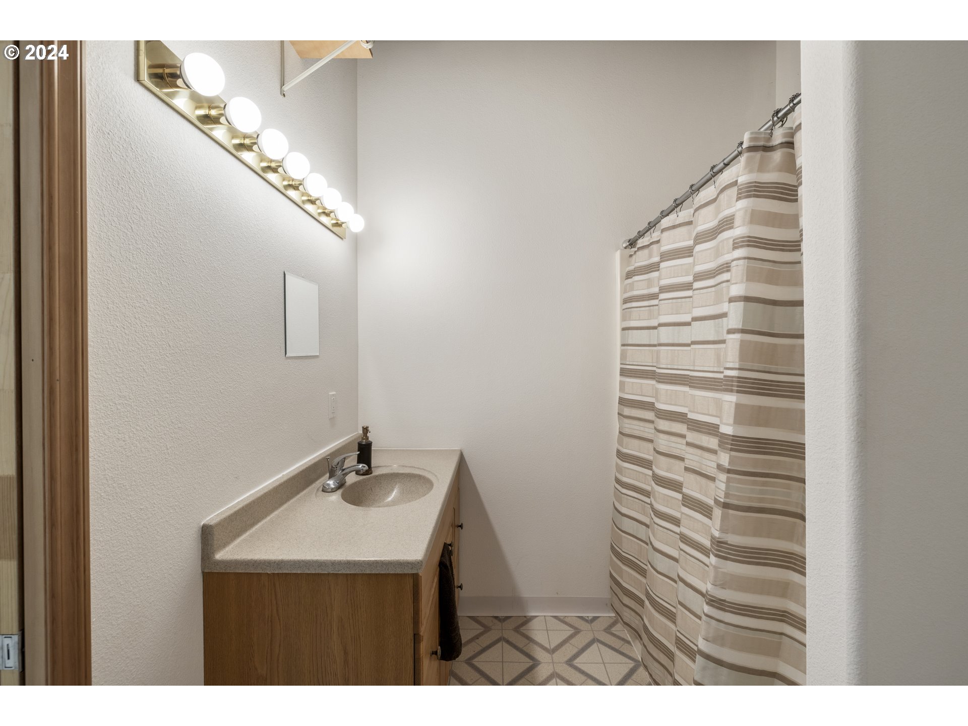 11400 Northwest Plainview Road Portland, OR 97231 - Photo 34 of 48 a bathroom with a sink and a mirror