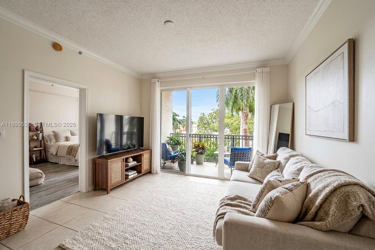 26 Royal Palm Way, Unit 304 Boca Raton, FL 33432 - Photo 11 of 38 a living room with furniture and a flat screen tv
