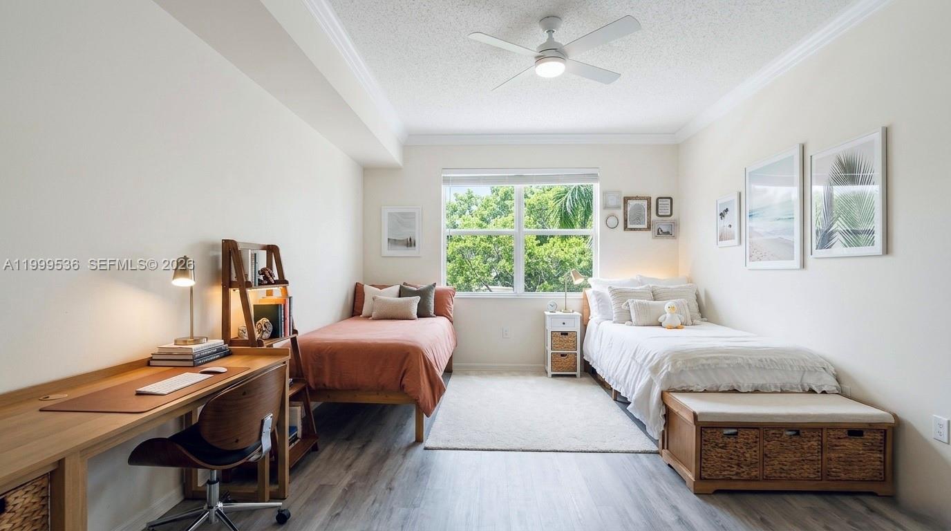 26 Royal Palm Way, Unit 304 Boca Raton, FL 33432 - Photo 15 of 38 a bedroom with two beds and a chandelier