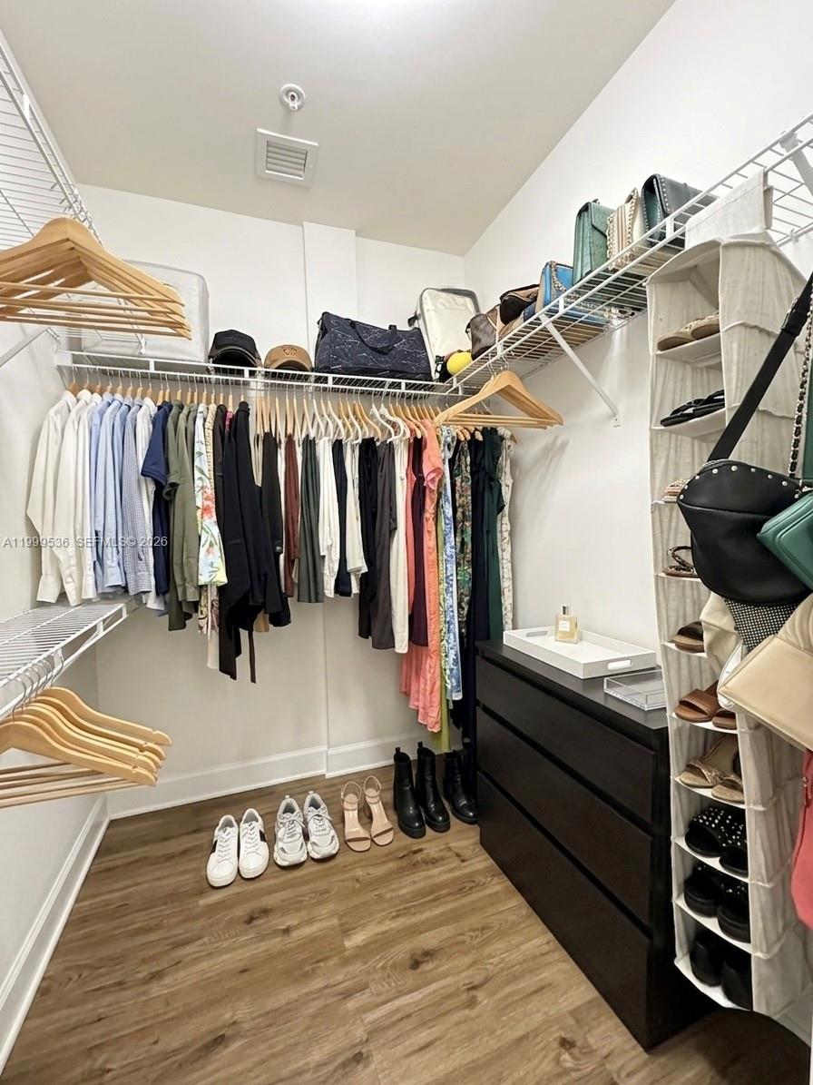 26 Royal Palm Way, Unit 304 Boca Raton, FL 33432 - Photo 16 of 38 a view of walk in closet with clothes and shoes