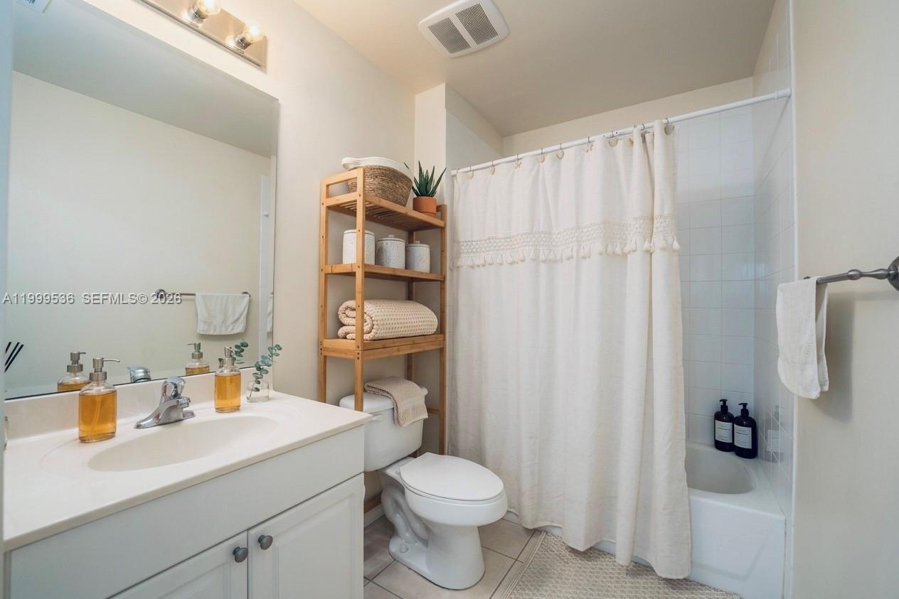 26 Royal Palm Way, Unit 304 Boca Raton, FL 33432 - Photo 21 of 38 a bathroom with a sink toilet and shower