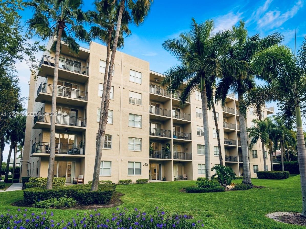 26 Royal Palm Way, Unit 304 Boca Raton, FL 33432 - Photo 24 of 38 a view of a building with a yard
