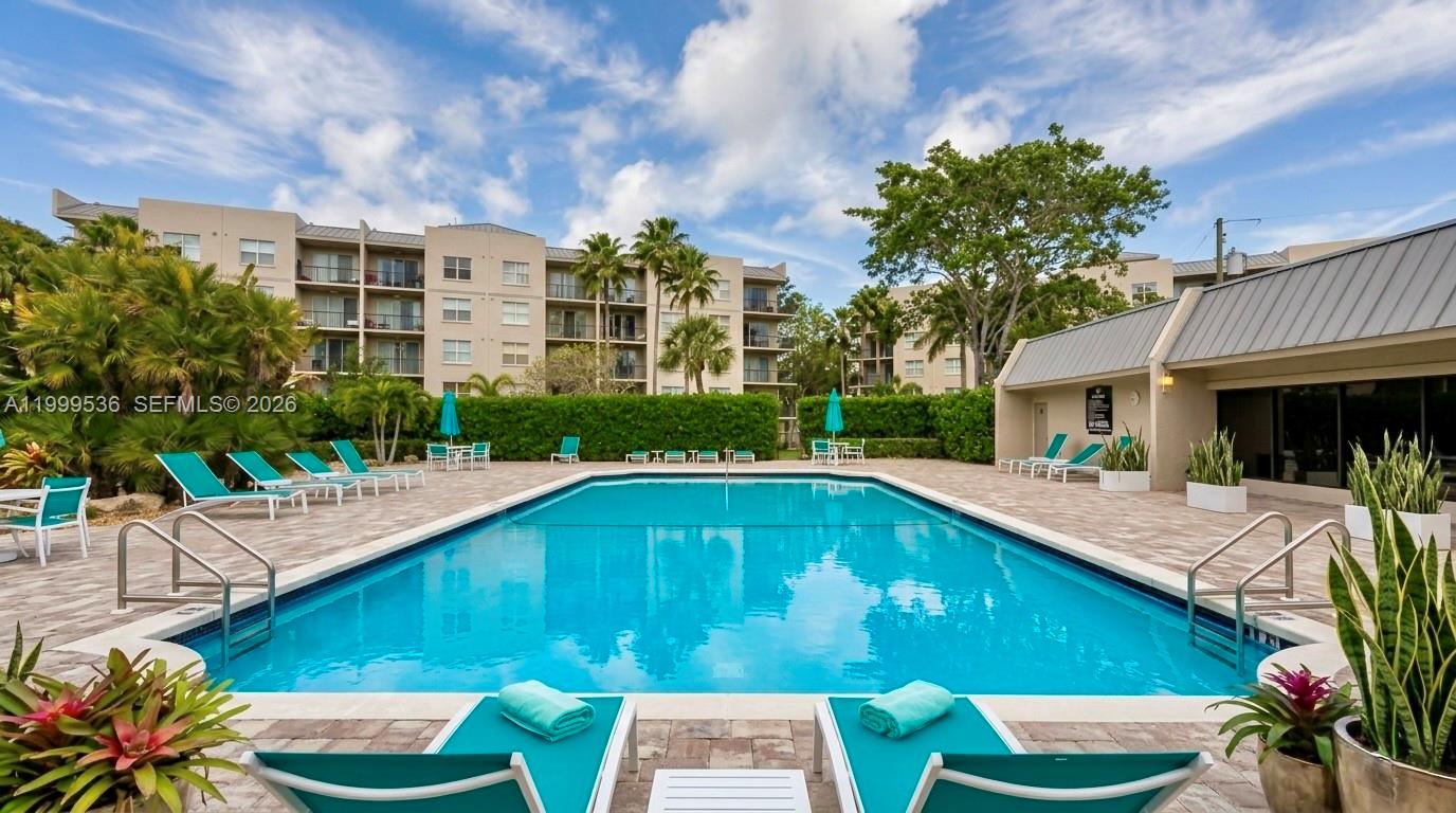 26 Royal Palm Way, Unit 304 Boca Raton, FL 33432 - Photo 28 of 38 a swimming pool with outdoor seating and yard