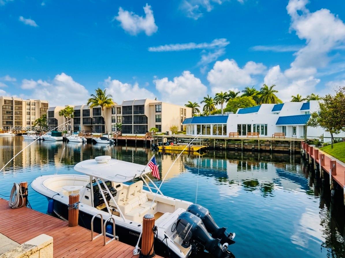 26 Royal Palm Way, Unit 304 Boca Raton, FL 33432 - Photo 32 of 38 a view of a house with swimming pool and sitting area