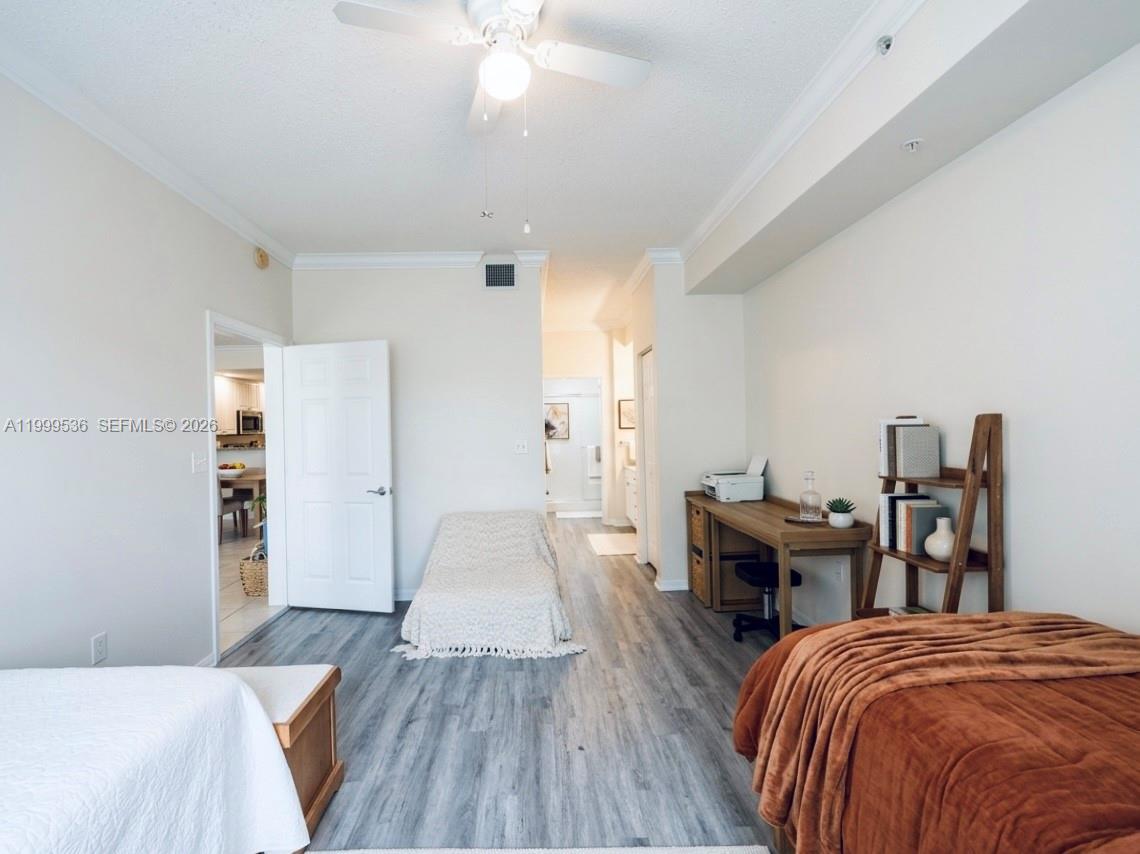 26 Royal Palm Way, Unit 304 Boca Raton, FL 33432 - Photo 7 of 38 a spacious bedroom with a bed and furniture