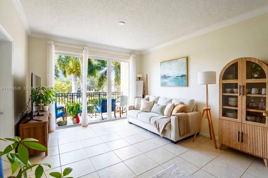 26 Royal Palm Way, Unit 304 Boca Raton, FL 33432 - Photo 9 of 38 a living room with furniture and a large window
