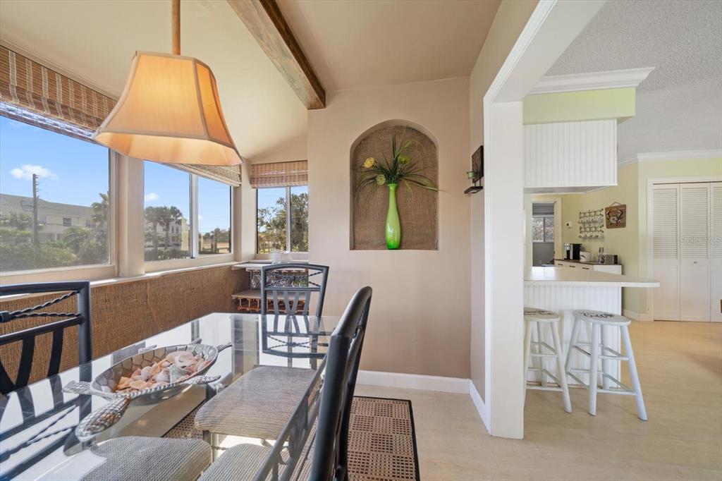 800 East Gulf Boulevard, Unit 5 Indian Rocks Beach, FL 33785 - Photo 20 of 52 a view of a dining room with furniture window and outside view