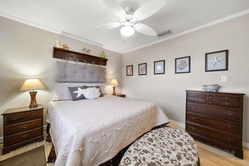 800 East Gulf Boulevard, Unit 5 Indian Rocks Beach, FL 33785 - Photo 25 of 52 a bedroom with a bed and a lamp