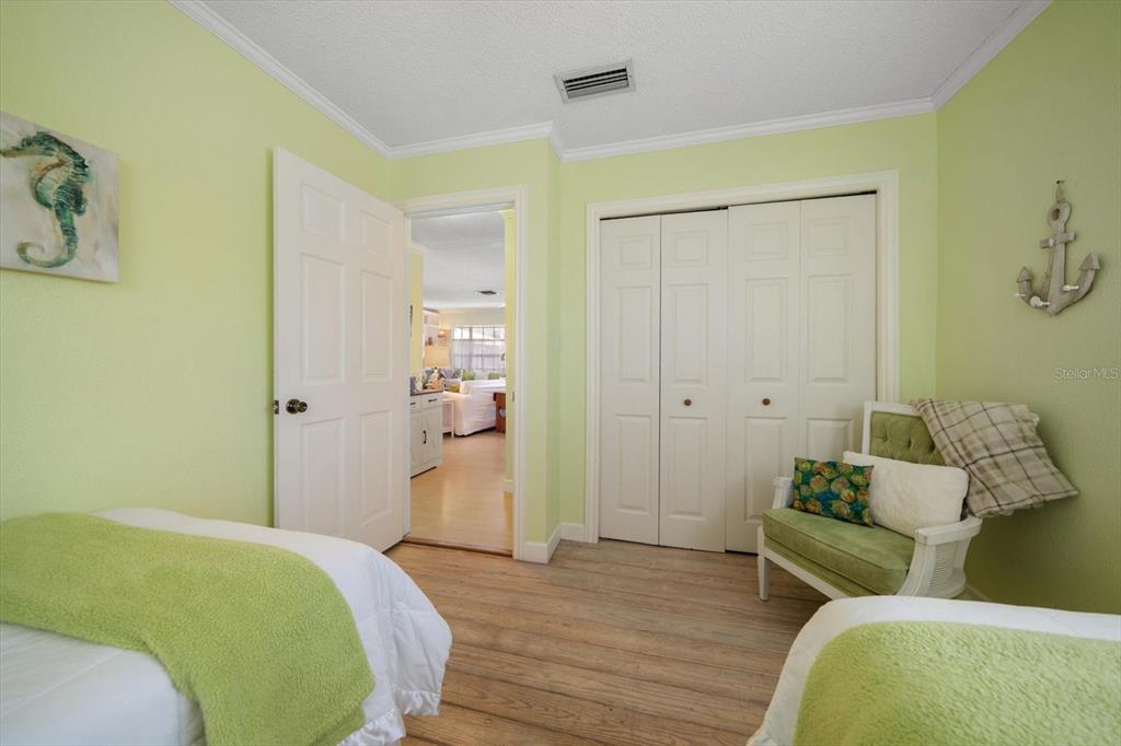 800 East Gulf Boulevard, Unit 5 Indian Rocks Beach, FL 33785 - Photo 29 of 52 a bedroom with a bed and couch