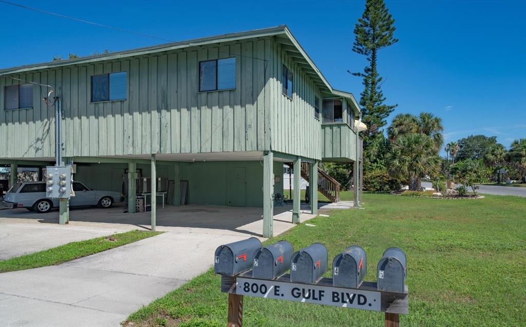 800 East Gulf Boulevard, Unit 5 Indian Rocks Beach, FL 33785 - Photo 36 of 52 a house with trees in the background