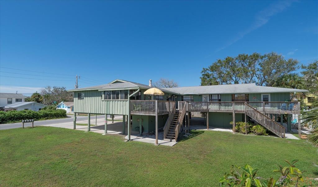 800 East Gulf Boulevard, Unit 5 Indian Rocks Beach, FL 33785 - Photo 5 of 52 a view of a house with a yard