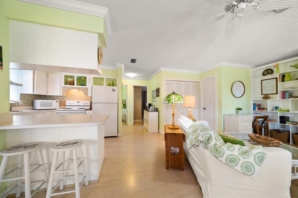 800 East Gulf Boulevard, Unit 5 Indian Rocks Beach, FL 33785 - Photo 8 of 52 a living room with furniture and a large window