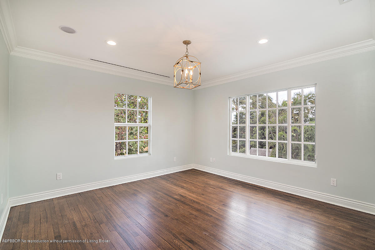 230 Murray Road West Palm Beach, FL 33405 - Photo 14 of 33 a view of an empty room with wooden floor and a window