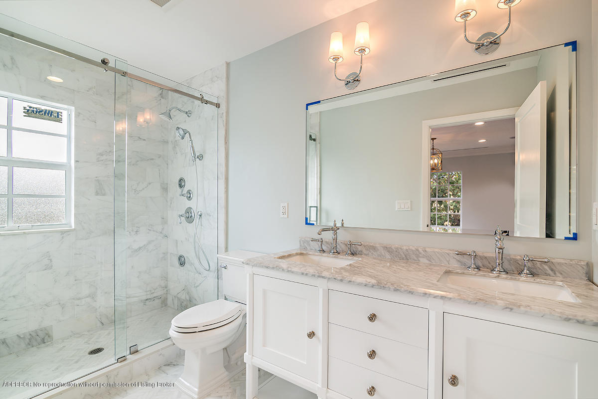 230 Murray Road West Palm Beach, FL 33405 - Photo 15 of 33 a bathroom with a granite countertop sink toilet and shower