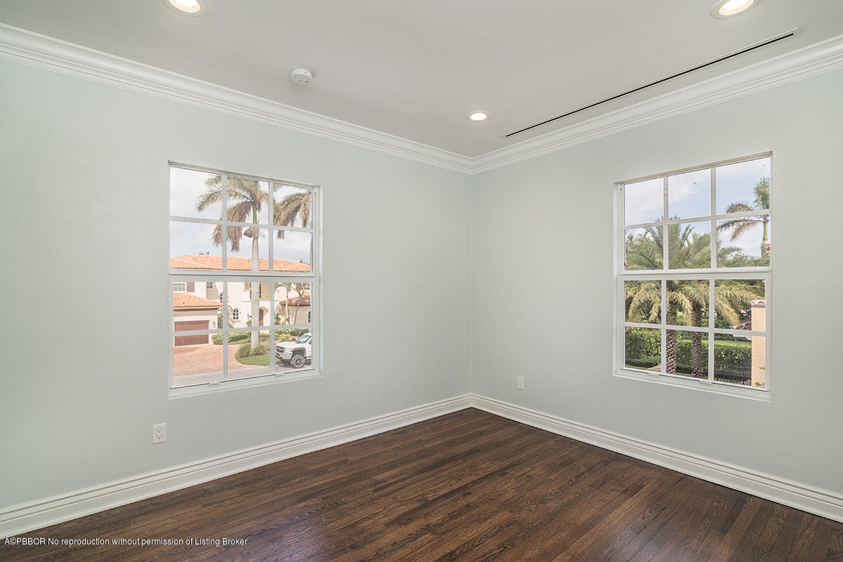 230 Murray Road West Palm Beach, FL 33405 - Photo 16 of 33 an empty room with wooden floor and windows