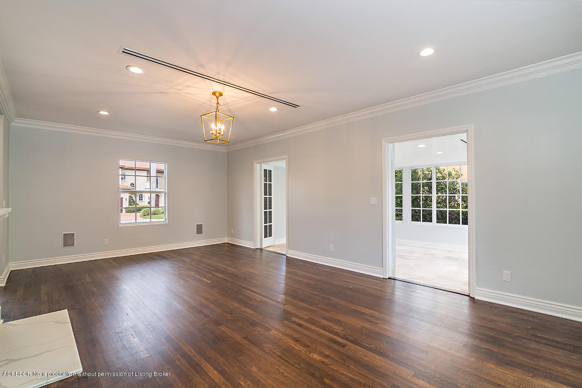 230 Murray Road West Palm Beach, FL 33405 - Photo 8 of 33 a view of an empty room with wooden floor and a window