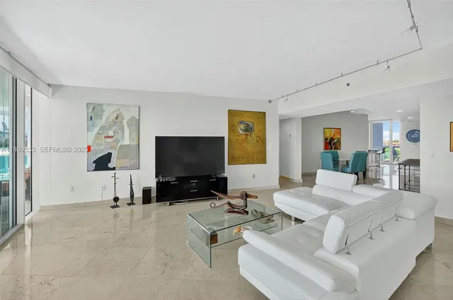a living room with furniture and a flat screen tv