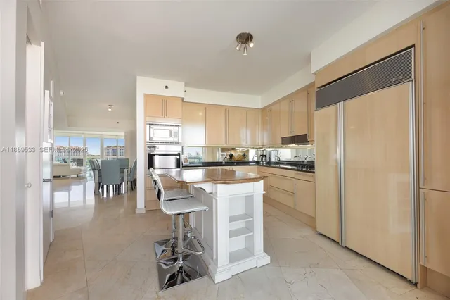 a kitchen with a table and chairs