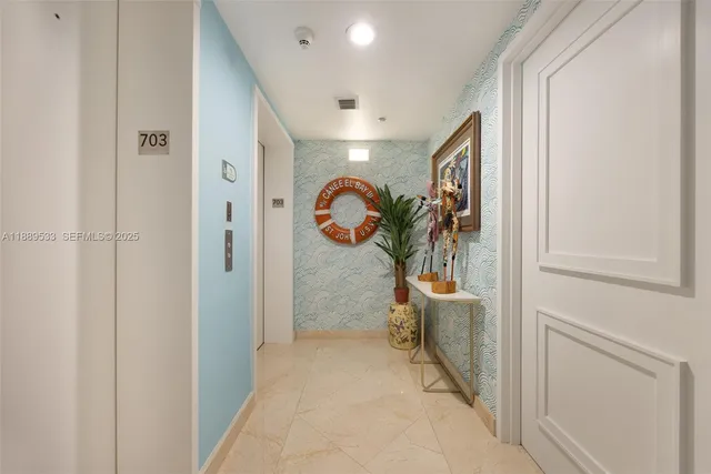 a view of a hallway with windows