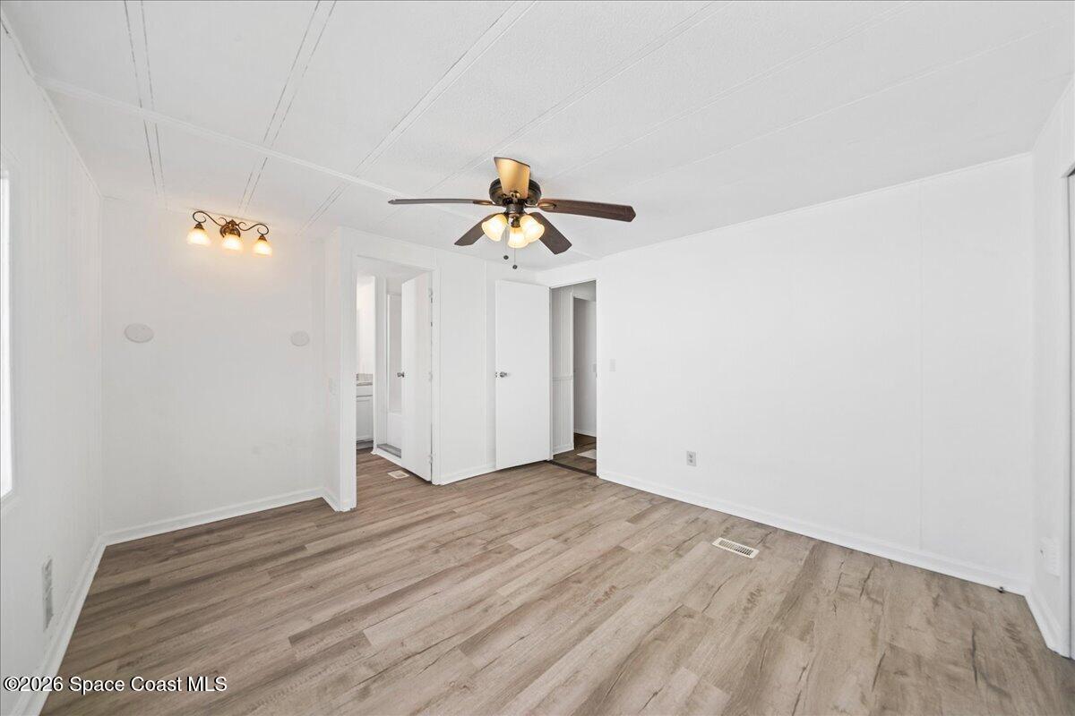 1848 Seagrape Street Northeast Palm Bay, FL 32905 - Photo 10 of 27 a view of empty room with wooden floor