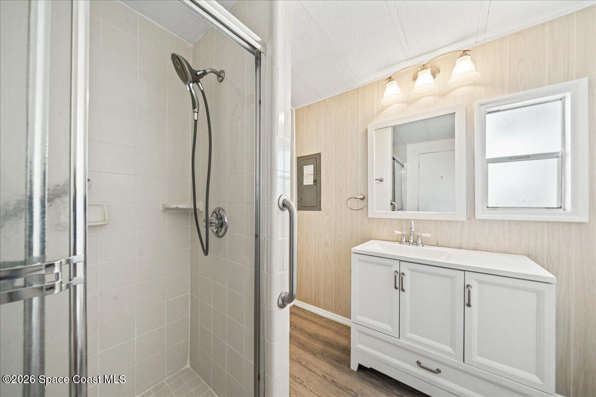 1848 Seagrape Street Northeast Palm Bay, FL 32905 - Photo 17 of 27 a bathroom with a double vanity sink mirror and