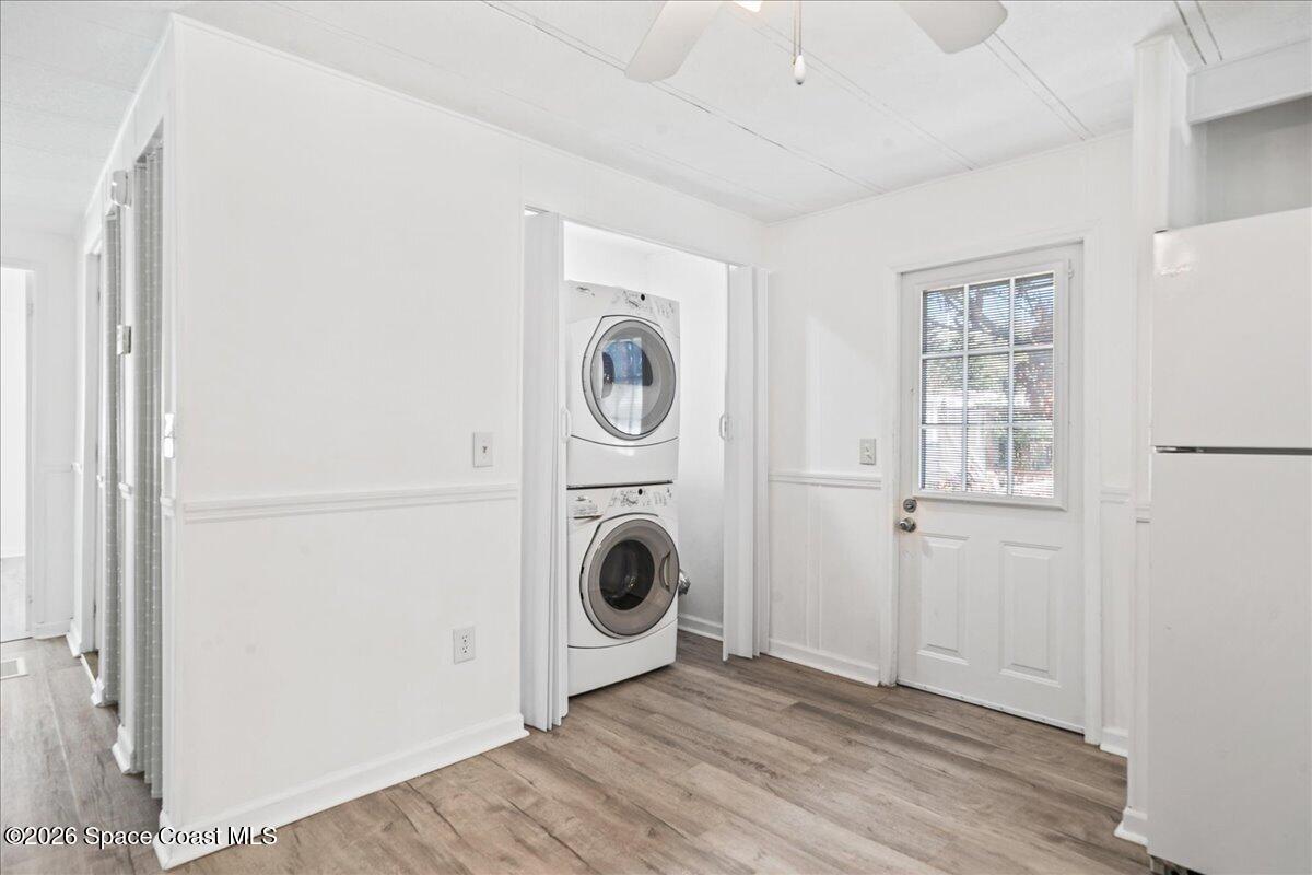 1848 Seagrape Street Northeast Palm Bay, FL 32905 - Photo 18 of 27 a view of a hallway with washer and dryer