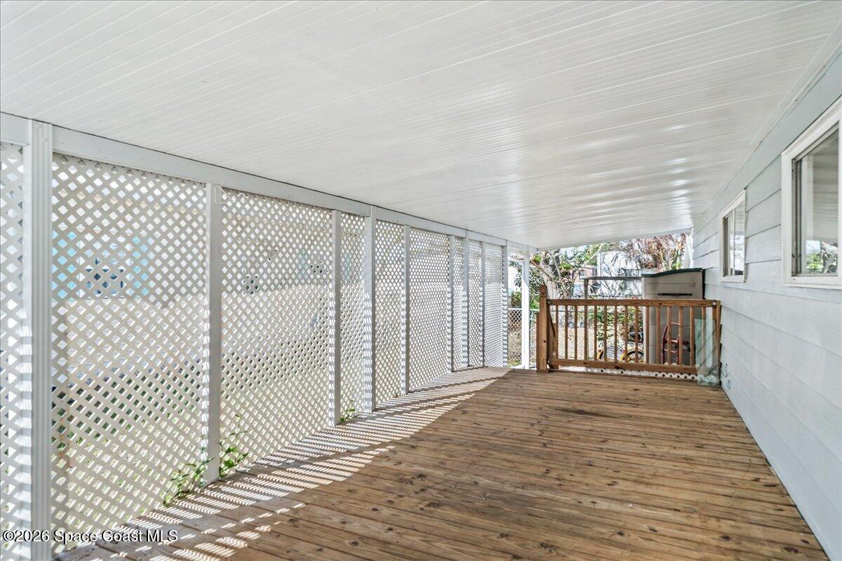 1848 Seagrape Street Northeast Palm Bay, FL 32905 - Photo 19 of 27 a view of a bedroom with wooden floor