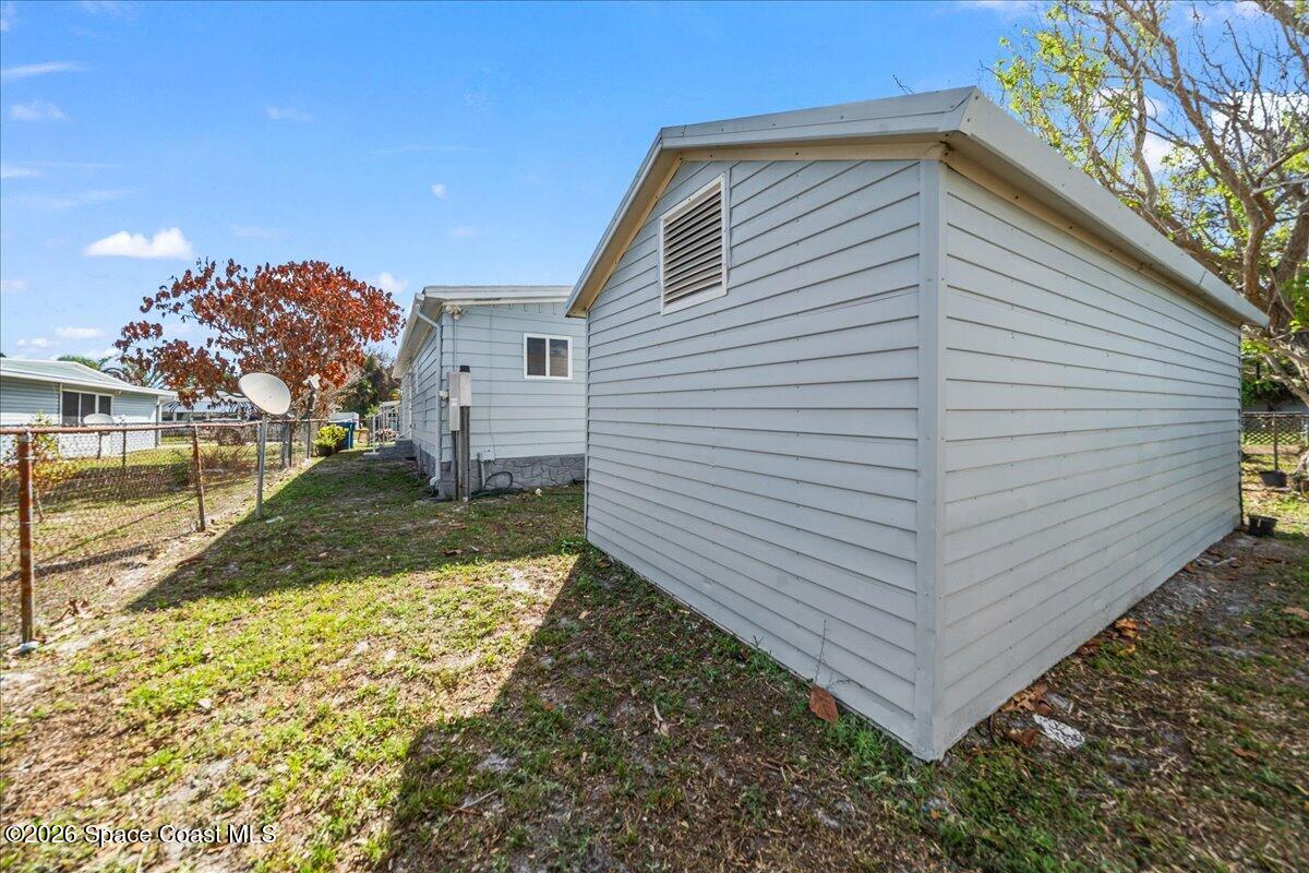 1848 Seagrape Street Northeast Palm Bay, FL 32905 - Photo 24 of 27 a view of a backyard
