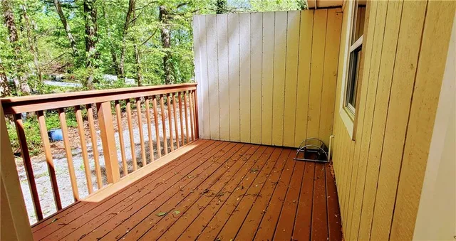 a view of wooden balcony with wooden floor