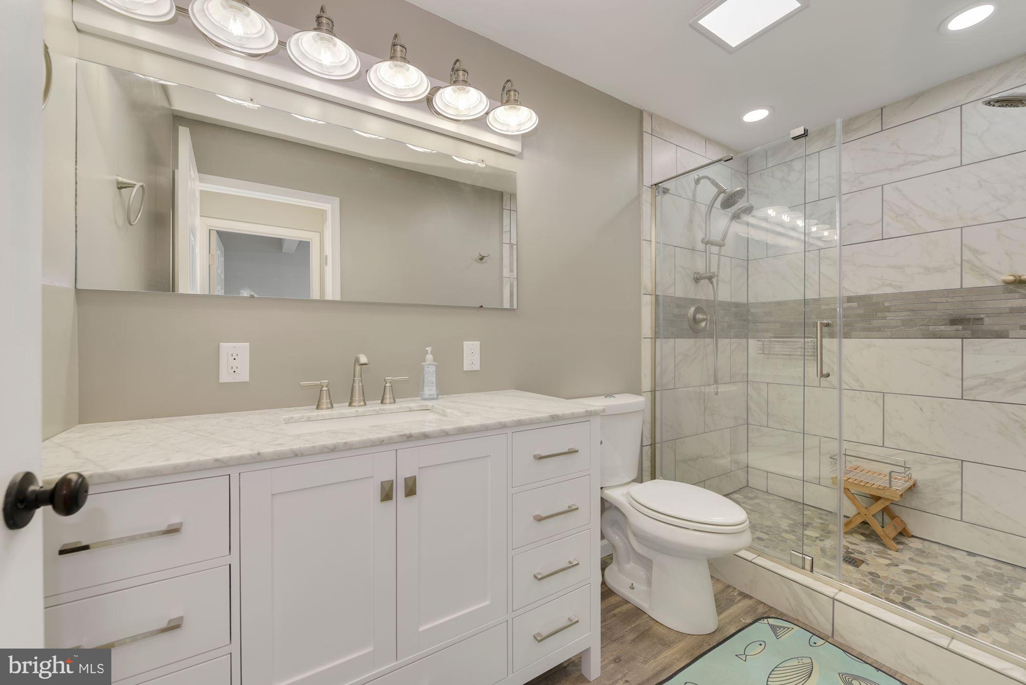 221 Arneys Mt Road Pemberton, NJ 08068 - Photo 12 of 28 a bathroom with a sink a toilet and a mirror