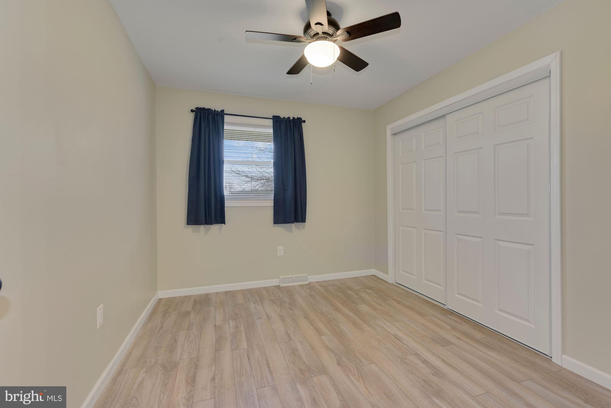 221 Arneys Mt Road Pemberton, NJ 08068 - Photo 14 of 28 a view of empty room with wooden floor and fan