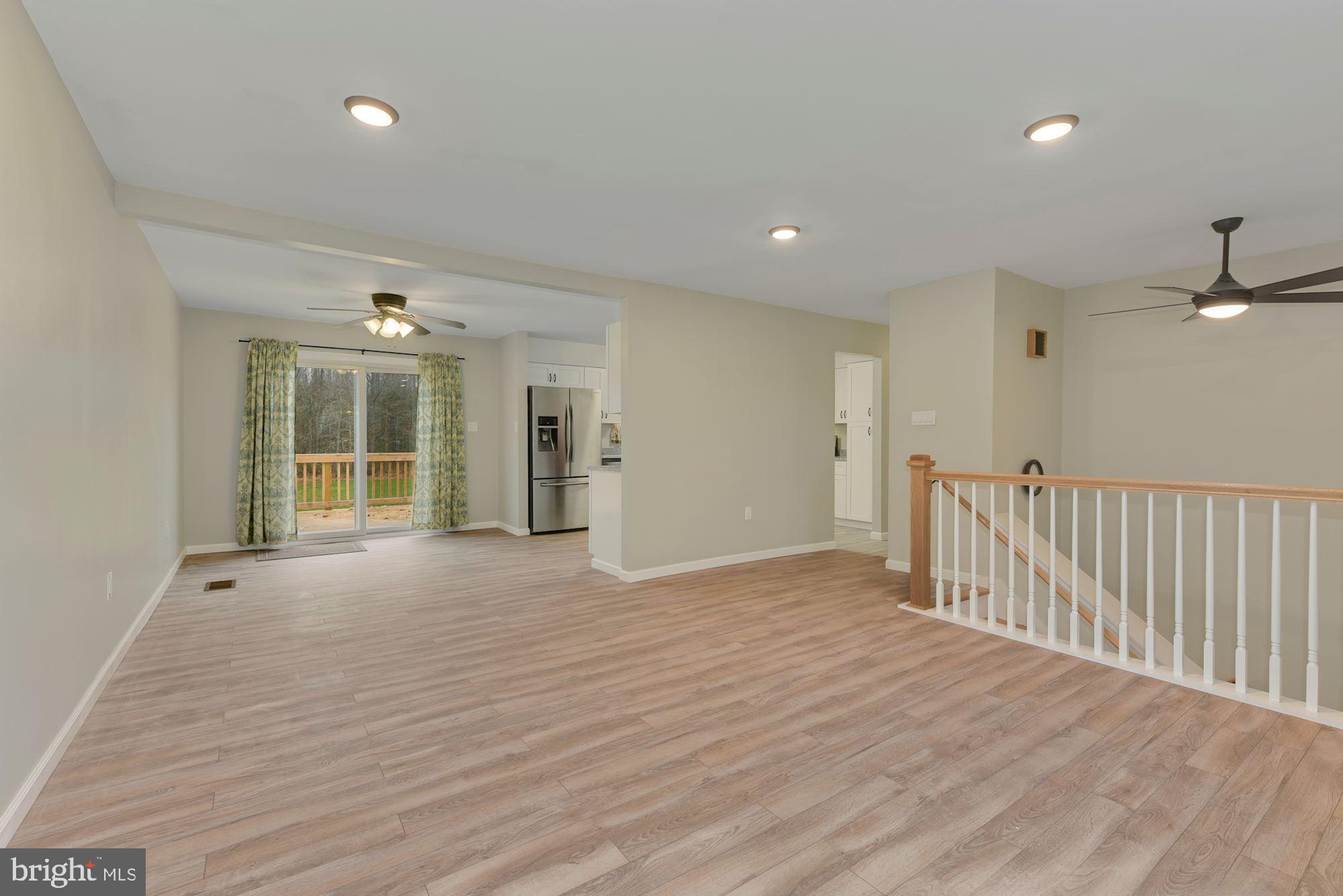 221 Arneys Mt Road Pemberton, NJ 08068 - Photo 6 of 28 a view of an empty room with wooden floor and a window
