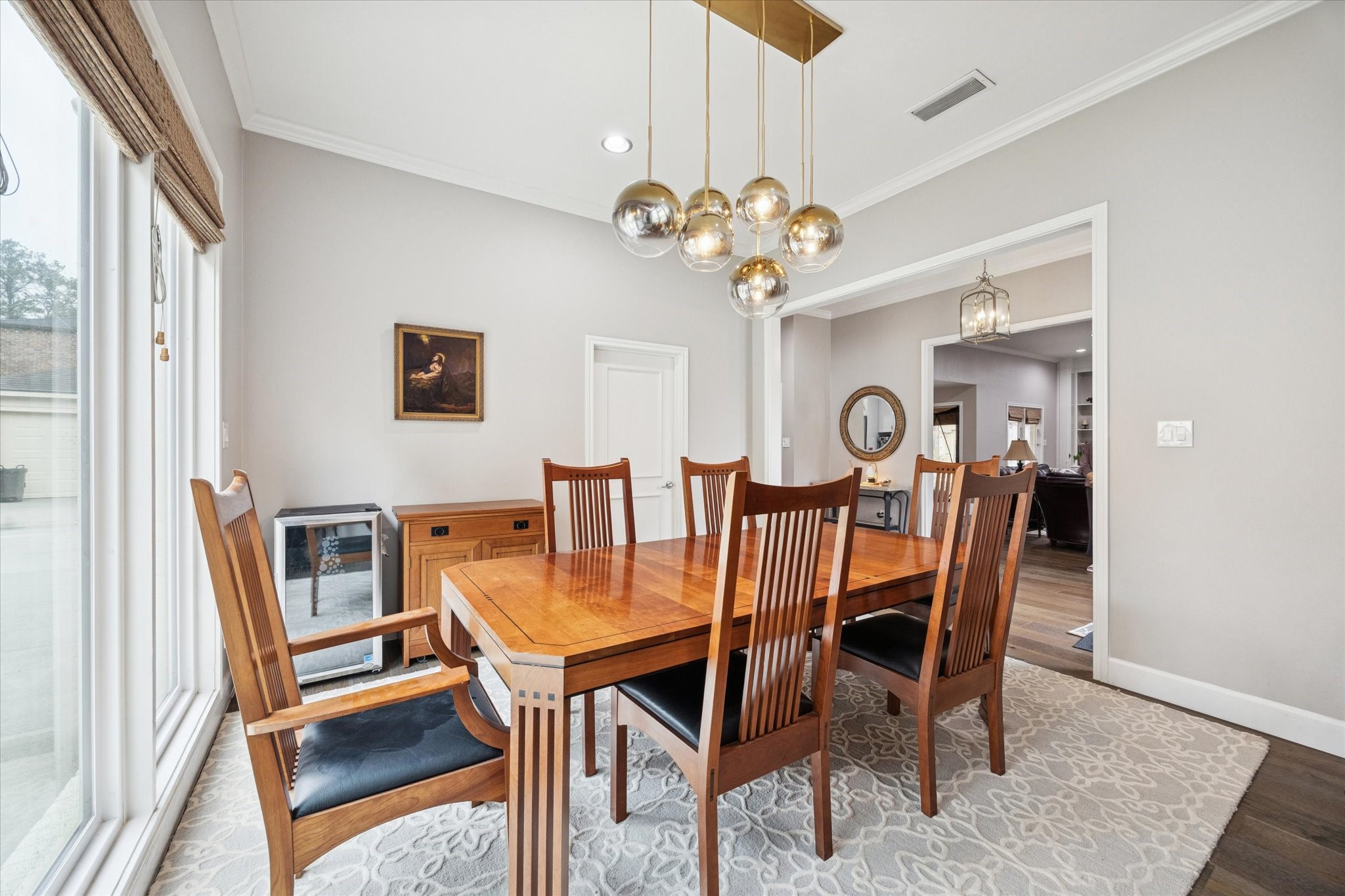 242 Vanderpool Lane Houston, TX 77024 - Photo 11 of 45 Bright dining room with large windows provide abundant natural light, and an open doorway leads to the adjacent living area.