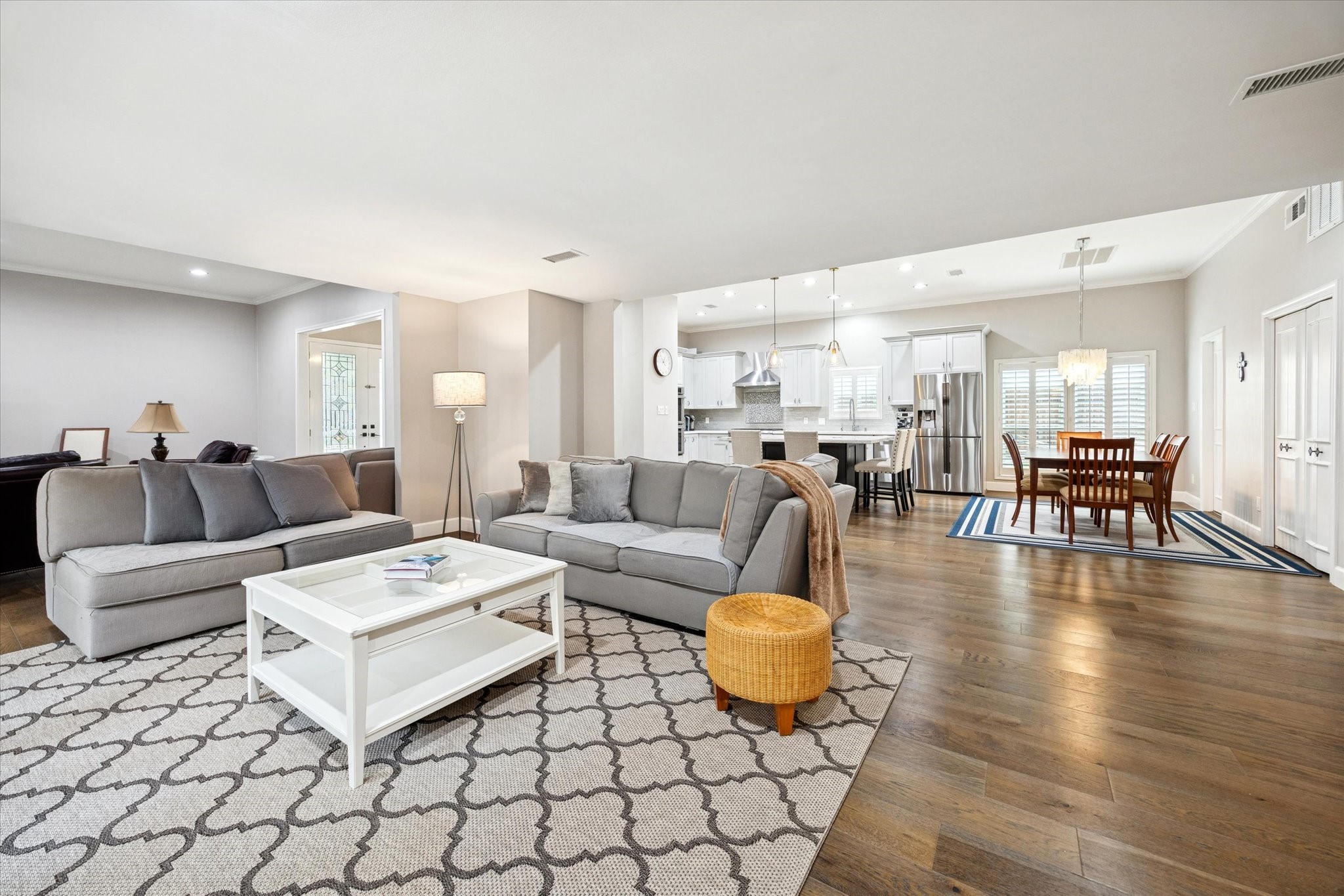 242 Vanderpool Lane Houston, TX 77024 - Photo 13 of 45 The spacious open-concept family living area offers a cozy and comfortable area for family gatherings or alone time. French doors lead to the patio area. Family room measures 26x15.