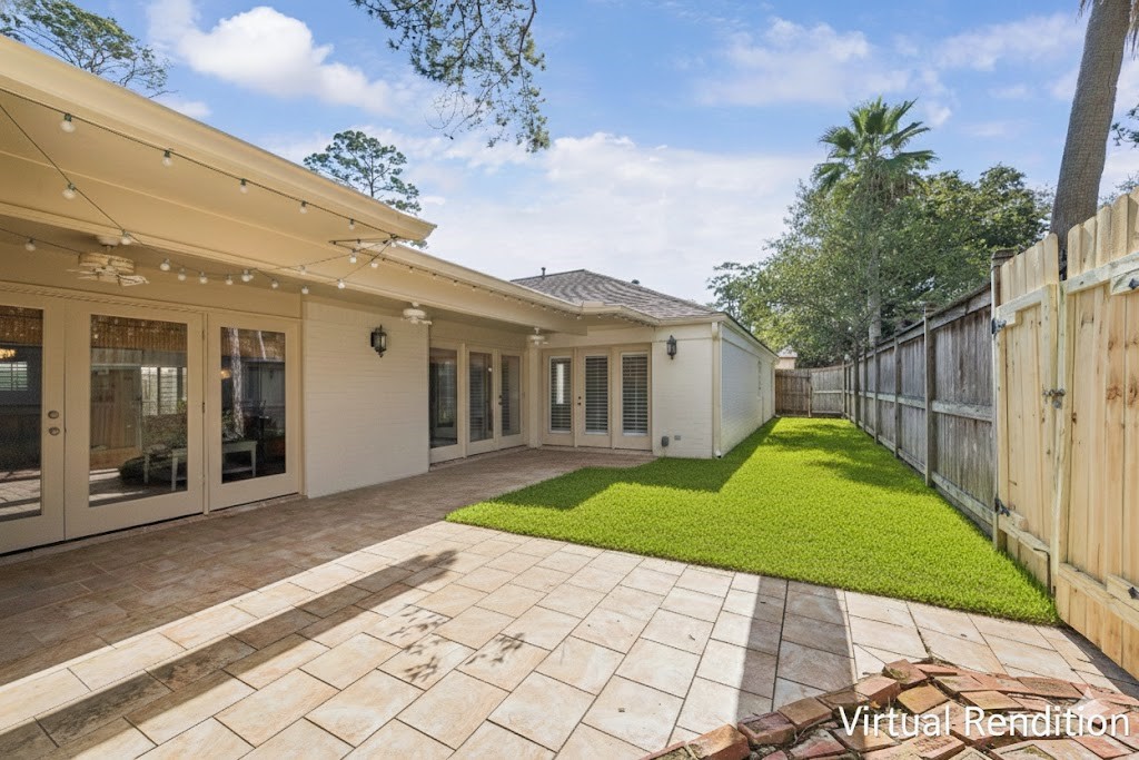 242 Vanderpool Lane Houston, TX 77024 - Photo 24 of 45 This virtual rendition showcases a spacious, inviting side yard with a sleek patio and lush green lawn, offering a perfect blank canvas for your outdoor oasis.