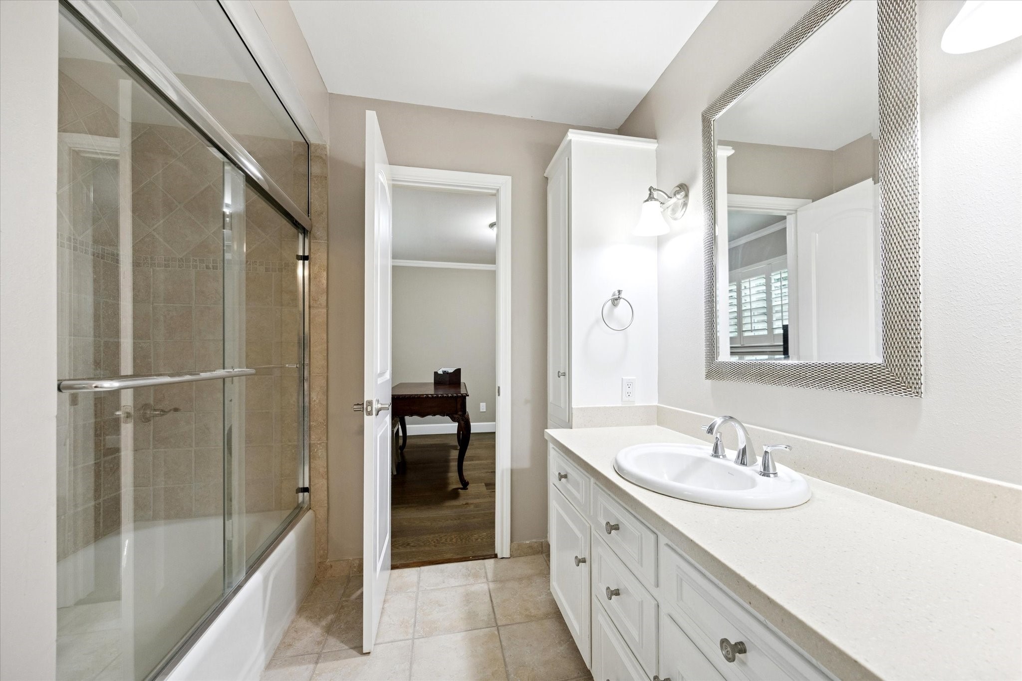 242 Vanderpool Lane Houston, TX 77024 - Photo 29 of 45 a bathroom with a shower tub double vanity sink and mirror