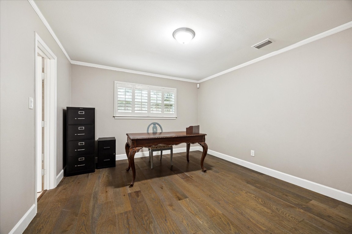 242 Vanderpool Lane Houston, TX 77024 - Photo 30 of 45 This forth bedroom features engineered hardwood floors and a window allowing natural light. It has a huge walk-in closet and shares the en-suite Hollywood bathroom. Room measures 14x11.