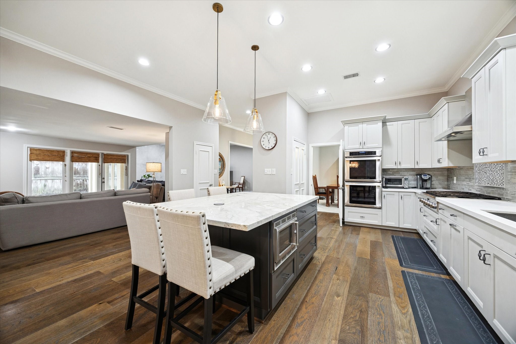 242 Vanderpool Lane Houston, TX 77024 - Photo 9 of 45 a large kitchen with a table and chairs
