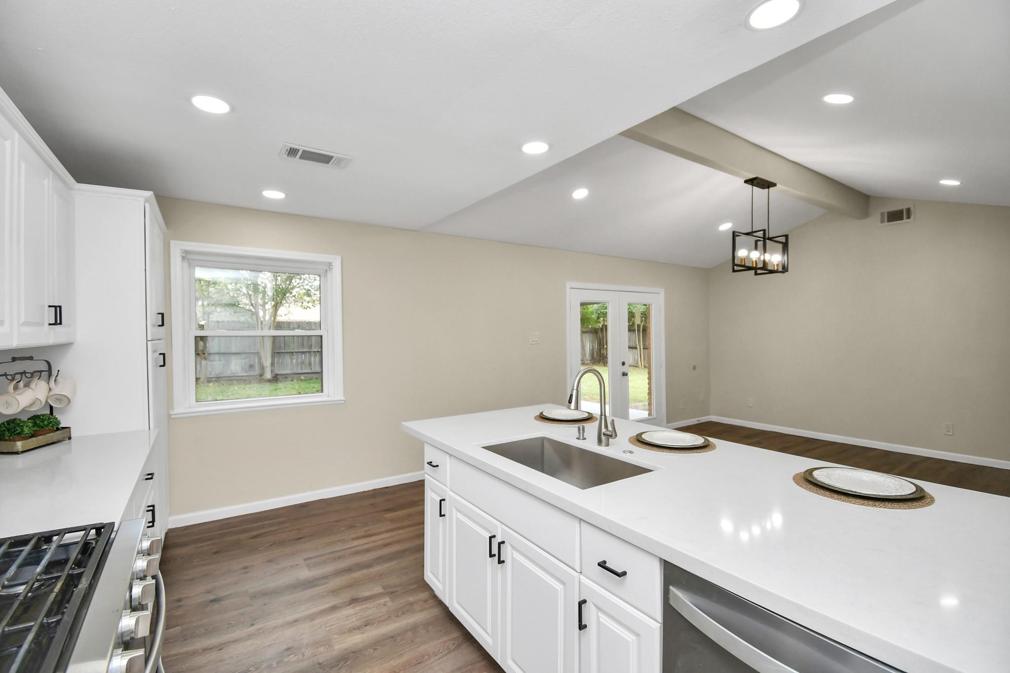 531 Edgebrook Drive Houston, TX 77034 - Photo 12 of 26 a kitchen with a sink and wooden floor