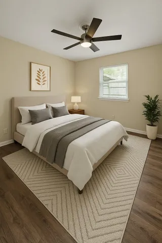 a bedroom with double bed and a window