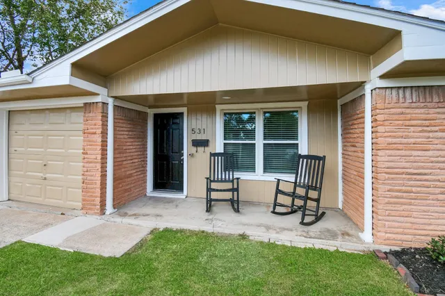 a backyard of a house with seating space
