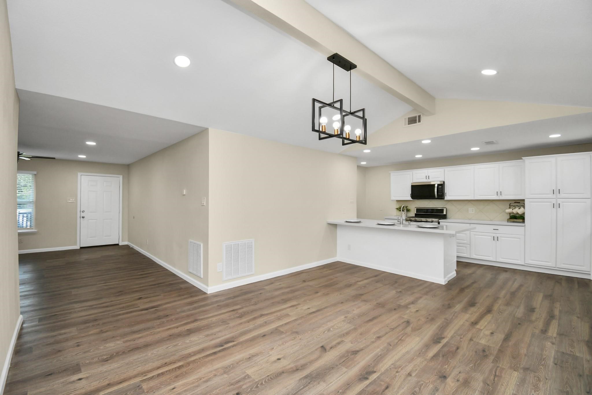 531 Edgebrook Drive Houston, TX 77034 - Photo 9 of 26 a view of kitchen with stainless steel appliances refrigerator stove microwave and cabinets