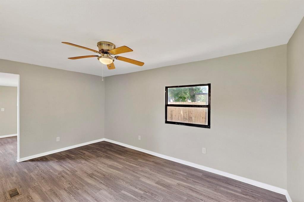 3112 Red River Street Melissa, TX 75454 - Photo 13 of 40 Unfurnished room featuring wood finished floors and a ceiling fan