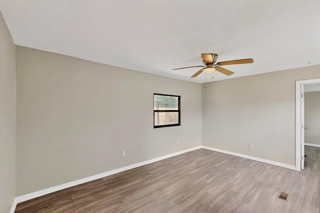 3112 Red River Street Melissa, TX 75454 - Photo 14 of 40 Unfurnished room featuring light wood-style floors and ceiling fan