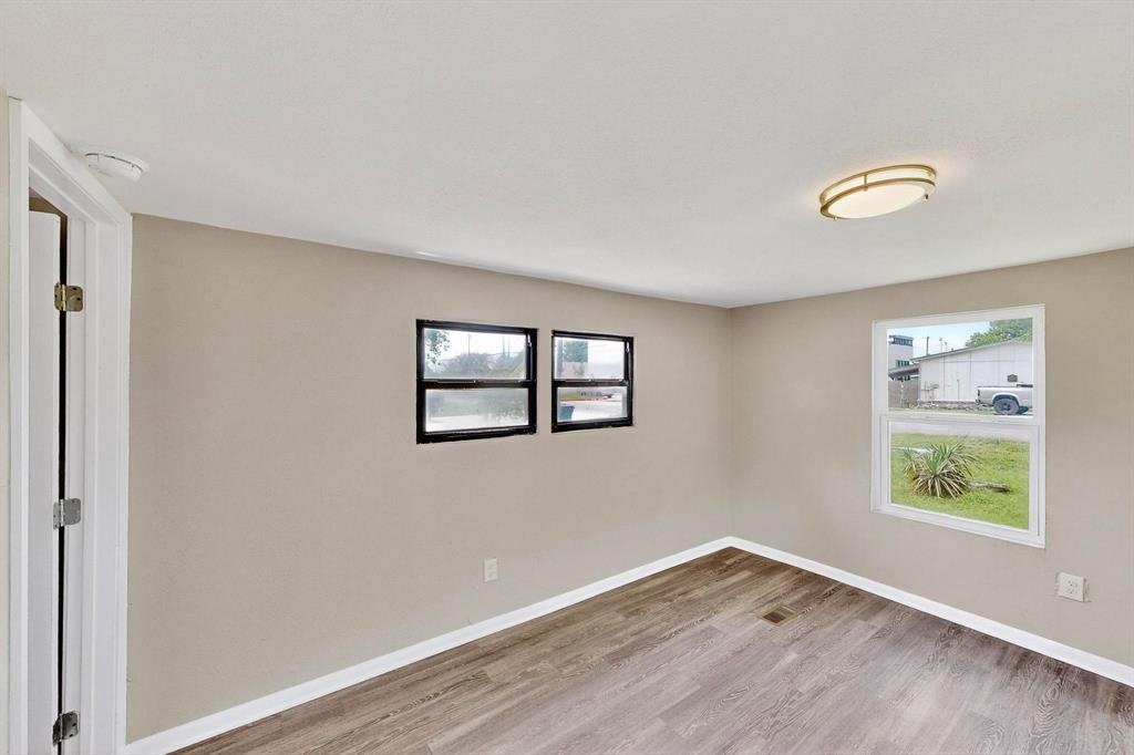 3112 Red River Street Melissa, TX 75454 - Photo 16 of 40 Spare room with baseboards and light wood finished floors