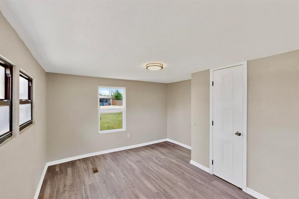 3112 Red River Street Melissa, TX 75454 - Photo 17 of 40 Unfurnished room featuring baseboards and light wood-style flooring