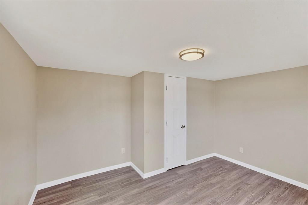 3112 Red River Street Melissa, TX 75454 - Photo 18 of 40 Unfurnished room with light wood-type flooring and baseboards