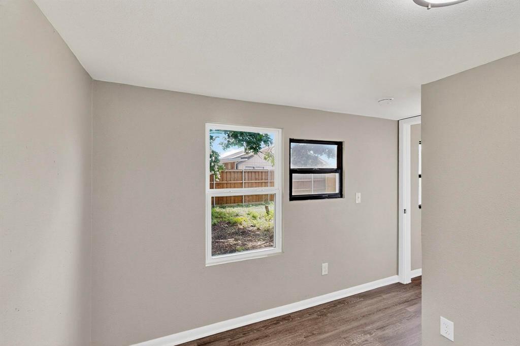 3112 Red River Street Melissa, TX 75454 - Photo 22 of 40 Spare room featuring baseboards and wood finished floors