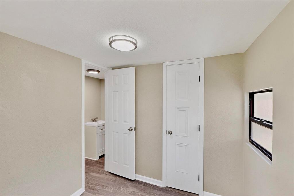 3112 Red River Street Melissa, TX 75454 - Photo 23 of 40 Unfurnished bedroom featuring baseboards and light wood-style flooring